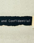 Private and confidential written on torn paper black background