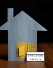 eviction notice sticker IN front of door - concept showing of tenant foreclosure or rent pending on black background
