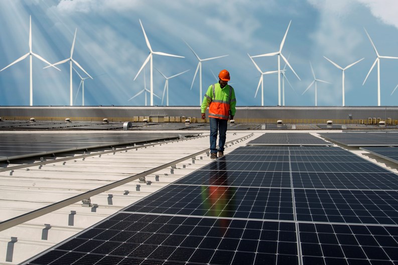 Inspector Engineer Man Holding Digital Tablet Working in Solar Panels Power Farm, Photovoltaic Cell Park, Green Energy Concept.