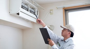 Multifamily Energy Conservation Tips Japanese contractor who inspects and repairs air conditioners, Japanese young people at work