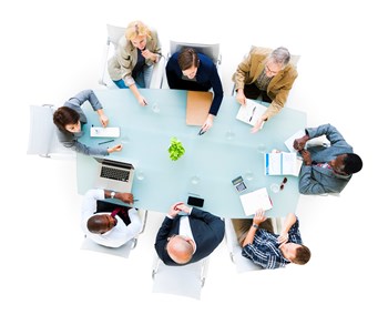 Overhead view of a group of business people at meeting.