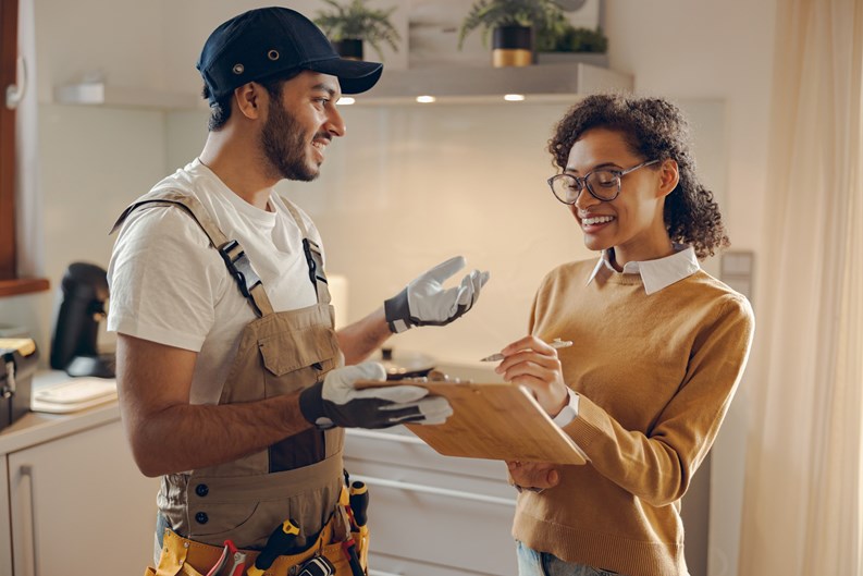 Male plumber or repairman close deal with female client after work or fix at home